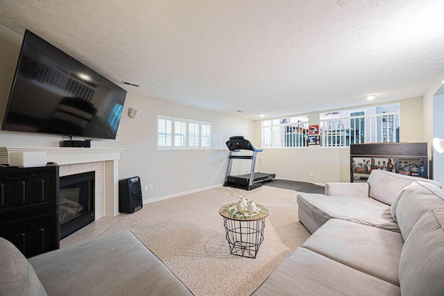 6838 Evergreen Cir, Dayton, OH 45424 - carpeted living area featuring a textured ceiling and a fireplace