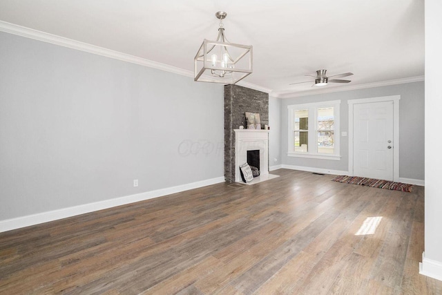 670-672 E Jenkins Ave, Columbus, OH 43207 - unfurnished living room featuring ornamental molding, a chandelier, wood finished floors, a brick fireplace, and ceiling fan