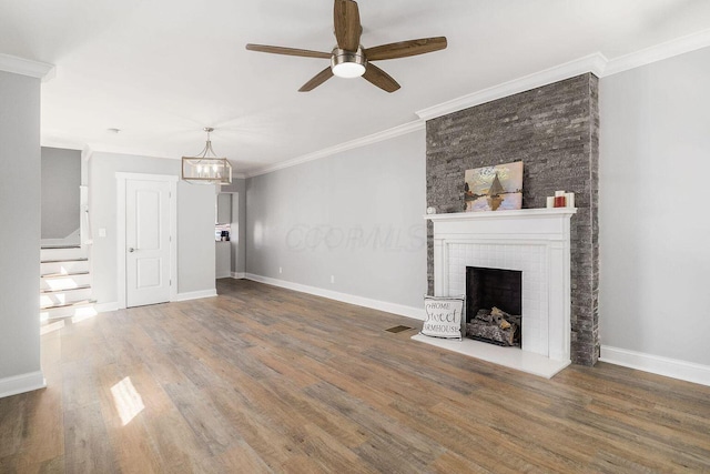 670-672 E Jenkins Ave, Columbus, OH 43207 - unfurnished living room with a ceiling fan, wood finished floors, a fireplace, stairway, and ornamental molding