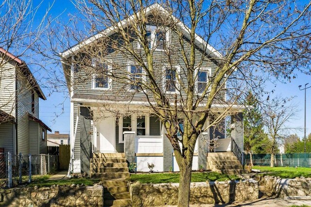 670-672 E Jenkins Ave, Columbus, OH 43207 - view of front of house with a porch and brick siding