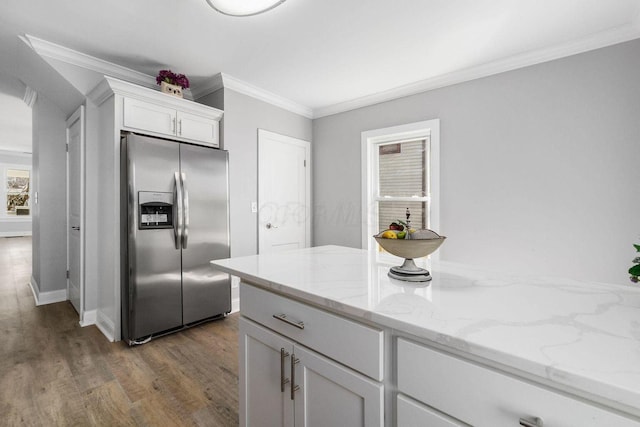 670-672 E Jenkins Ave, Columbus, OH 43207 - kitchen with stainless steel refrigerator with ice dispenser, white cabinets, crown molding, dark wood-style floors, and light stone countertops