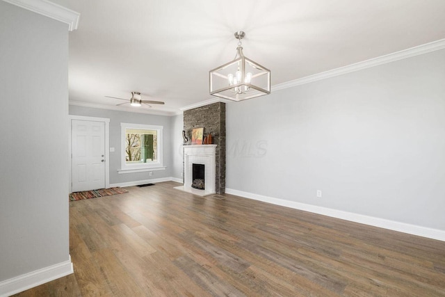 670-672 E Jenkins Ave, Columbus, OH 43207 - unfurnished living room with crown molding, a ceiling fan, a brick fireplace, wood finished floors, and a chandelier