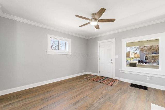 670-672 E Jenkins Ave, Columbus, OH 43207 - foyer with wood finished floors, ornamental molding, and a ceiling fan