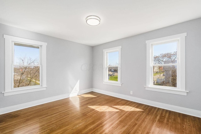 670-672 E Jenkins Ave, Columbus, OH 43207 - spare room featuring wood finished floors and plenty of natural light