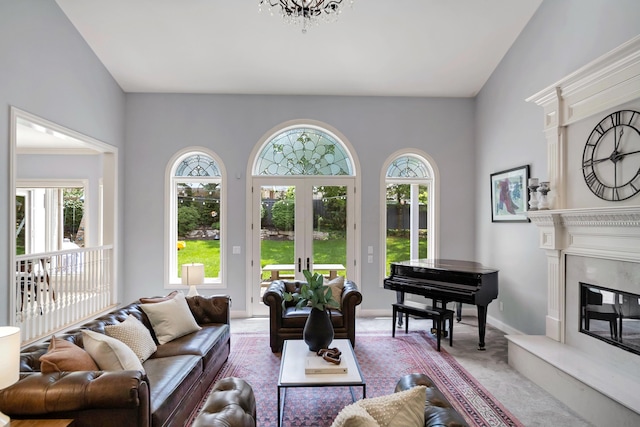 3917 Tarrington Ln, Columbus, OH 43220 - living room with light colored carpet, a fireplace, and french doors