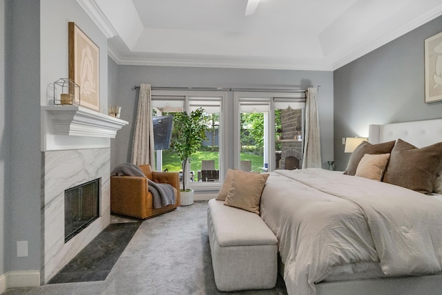 3917 Tarrington Ln, Columbus, OH 43220 - bedroom featuring a raised ceiling, a premium fireplace, carpet, ceiling fan, and crown molding