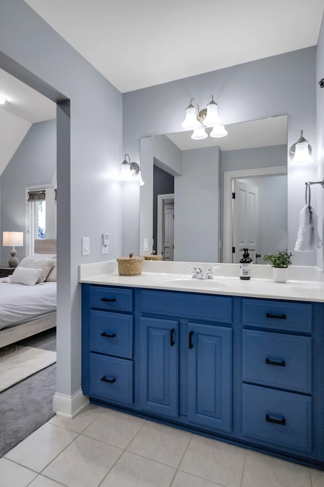3917 Tarrington Ln, Columbus, OH 43220 - bathroom with vanity, a chandelier, ensuite bathroom, tile patterned floors, and lofted ceiling