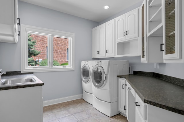 3917 Tarrington Ln, Columbus, OH 43220 - washroom featuring independent washer and dryer, cabinet space, and recessed lighting