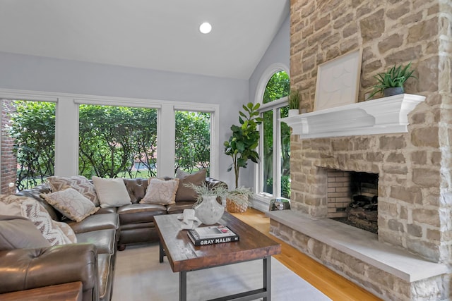 3917 Tarrington Ln, Columbus, OH 43220 - living room featuring a fireplace, wood finished floors, and lofted ceiling