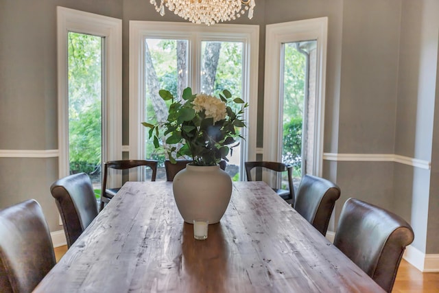 3917 Tarrington Ln, Columbus, OH 43220 - dining area featuring a chandelier and wood finished floors