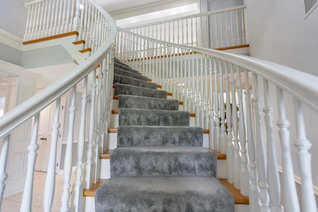 3917 Tarrington Ln, Columbus, OH 43220 - stairway with a high ceiling and tile patterned flooring