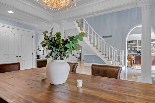 3917 Tarrington Ln, Columbus, OH 43220 - dining area featuring ornate columns, stairs, crown molding, a chandelier, and arched walkways