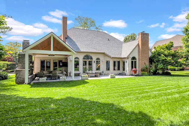 3917 Tarrington Ln, Columbus, OH 43220 - back of property with an outdoor hangout area, a chimney, a patio, and a lawn