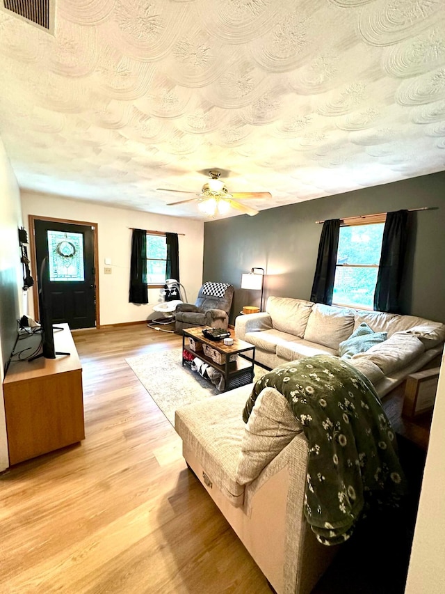 158 Kennedy Blvd, Leesburg, OH 45135 - living area with light wood-type flooring, ceiling fan, and a textured ceiling