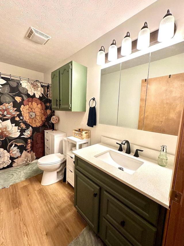 158 Kennedy Blvd, Leesburg, OH 45135 - bathroom with wood finished floors, vanity, and a textured ceiling