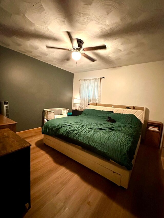 158 Kennedy Blvd, Leesburg, OH 45135 - bedroom with wood finished floors, a ceiling fan, and a textured ceiling