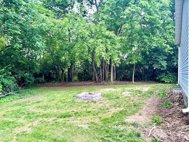158 Kennedy Blvd, Leesburg, OH 45135 - view of grassy yard featuring an outdoor fire pit