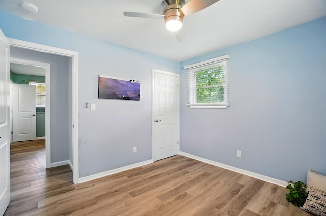 248 Grandview Ave, Delaware, OH 43015 - unfurnished bedroom featuring light wood-type flooring, ceiling fan, and a closet