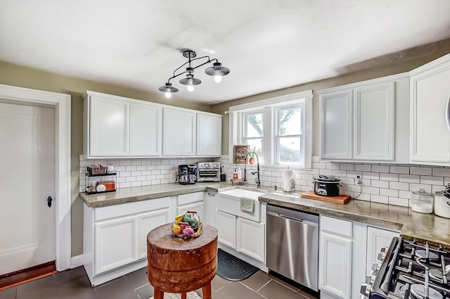 6997 State Route 734, Jamestown, OH 45335 - kitchen with dishwasher, dark tile patterned floors, and decorative backsplash