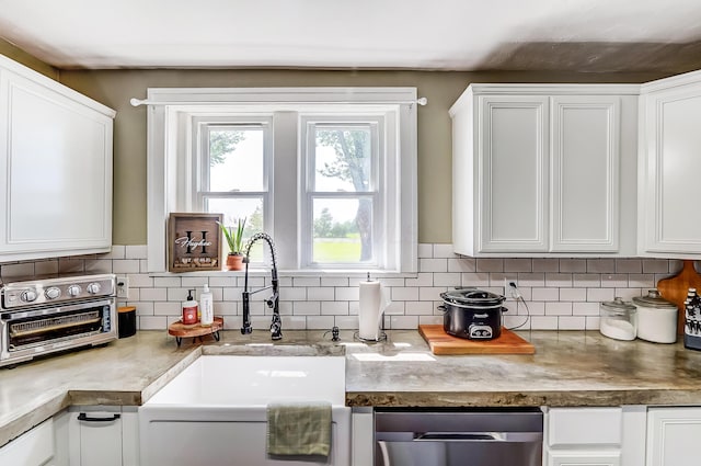 6997 State Route 734, Jamestown, OH 45335 - kitchen featuring stainless steel dishwasher, white cabinetry, and tasteful backsplash