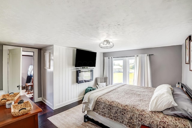6997 State Route 734, Jamestown, OH 45335 - bedroom with dark wood-style flooring and a textured ceiling