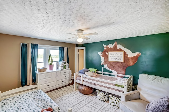 6997 State Route 734, Jamestown, OH 45335 - bedroom with a textured ceiling and ceiling fan