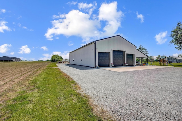 6997 State Route 734, Jamestown, OH 45335 - view of outbuilding with a playground and gravel driveway
