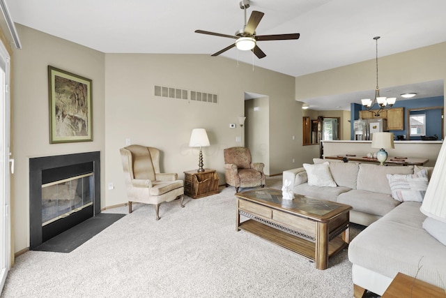 1104 Arbor Oaks Ln, Galloway, OH 43119 - carpeted living area with a chandelier, vaulted ceiling, a fireplace with flush hearth, and ceiling fan
