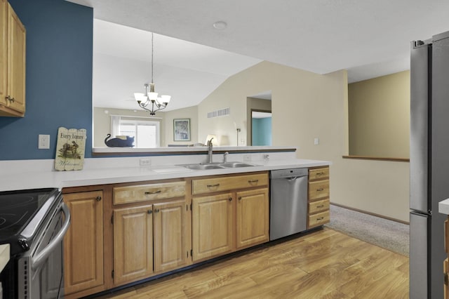 1104 Arbor Oaks Ln, Galloway, OH 43119 - kitchen featuring appliances with stainless steel finishes, light countertops, a chandelier, light wood finished floors, and vaulted ceiling