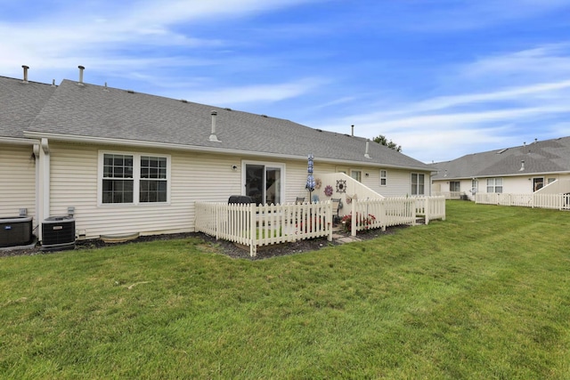 1104 Arbor Oaks Ln, Galloway, OH 43119 - back of property with a deck, a lawn, and roof with shingles
