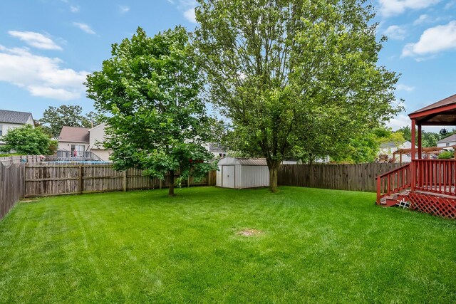 1344 Bluffton Ct, Columbus, OH 43228 - fenced backyard featuring a storage unit and a gazebo