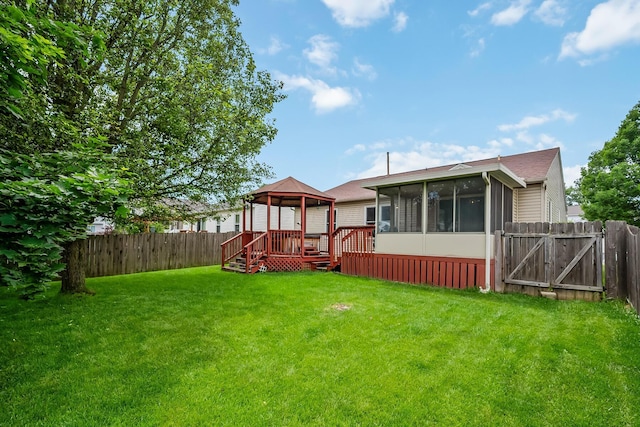 1344 Bluffton Ct, Columbus, OH 43228 - fenced backyard with a gazebo, a sunroom, and a gate