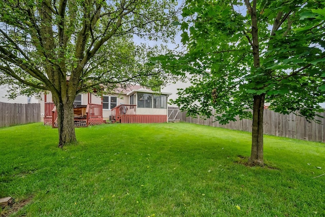 1344 Bluffton Ct, Columbus, OH 43228 - fenced backyard with a sunroom and a deck