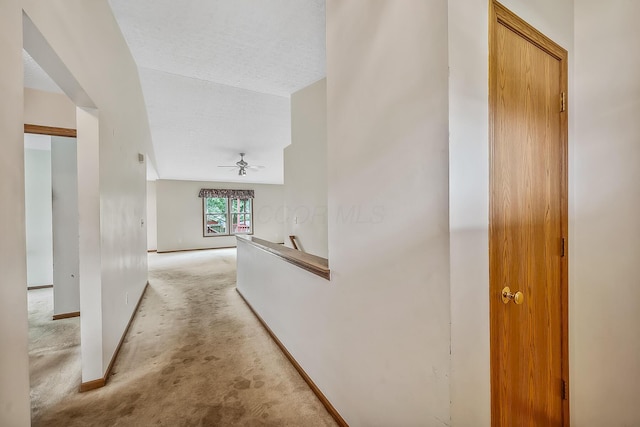 1344 Bluffton Ct, Columbus, OH 43228 - hall featuring light colored carpet, an upstairs landing, and a textured ceiling