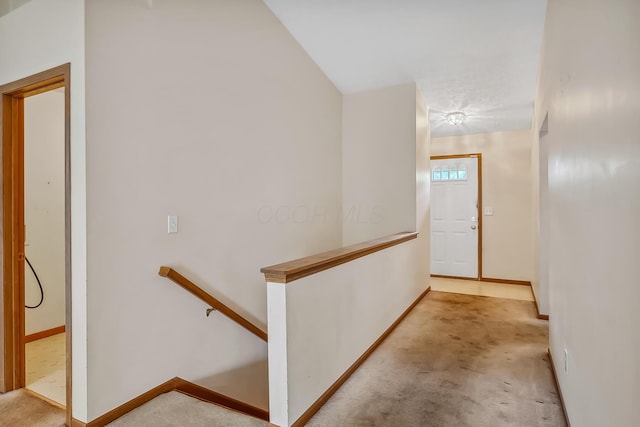 1344 Bluffton Ct, Columbus, OH 43228 - hallway with an upstairs landing and carpet flooring