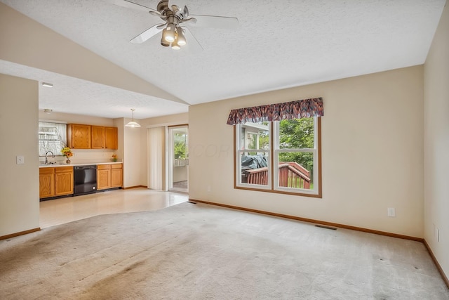 1344 Bluffton Ct, Columbus, OH 43228 - unfurnished living room with light carpet, a textured ceiling, ceiling fan, and vaulted ceiling