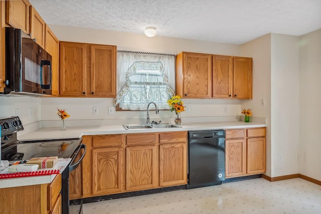 1344 Bluffton Ct, Columbus, OH 43228 - kitchen with black appliances, a textured ceiling, light countertops, brown cabinets, and light floors