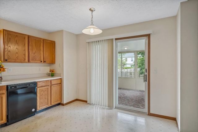 1344 Bluffton Ct, Columbus, OH 43228 - kitchen featuring dishwasher, light floors, light countertops, brown cabinetry, and pendant lighting