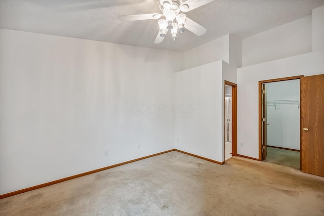 1344 Bluffton Ct, Columbus, OH 43228 - unfurnished bedroom featuring carpet flooring, a closet, a spacious closet, and ceiling fan