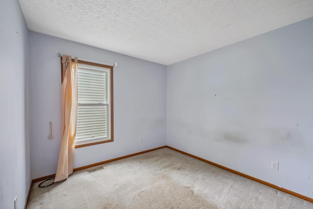 1344 Bluffton Ct, Columbus, OH 43228 - spare room with carpet and a textured ceiling