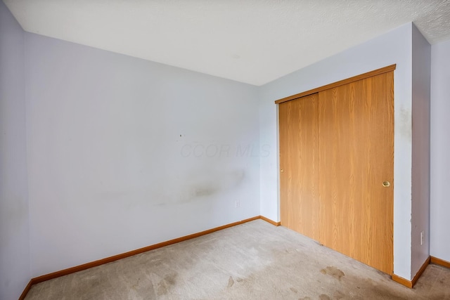 1344 Bluffton Ct, Columbus, OH 43228 - unfurnished bedroom with carpet and a closet