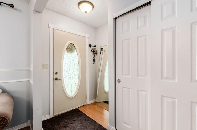 7484 Blue Fox Ln, Columbus, OH 43235 - entrance foyer with baseboards and a textured ceiling