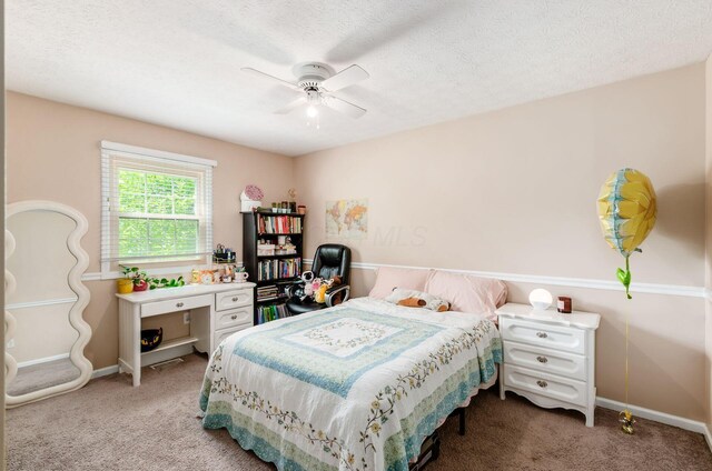 7484 Blue Fox Ln, Columbus, OH 43235 - bedroom featuring carpet floors, ceiling fan, and a textured ceiling