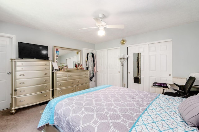 7484 Blue Fox Ln, Columbus, OH 43235 - bedroom featuring carpet floors, two closets, and a ceiling fan