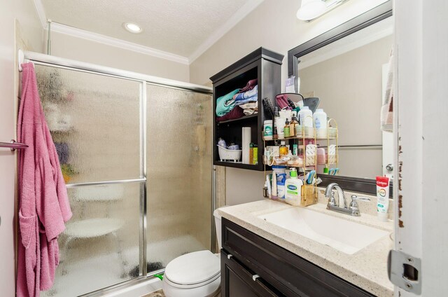 7484 Blue Fox Ln, Columbus, OH 43235 - bathroom featuring vanity, a shower stall, ornamental molding, a textured ceiling, and recessed lighting