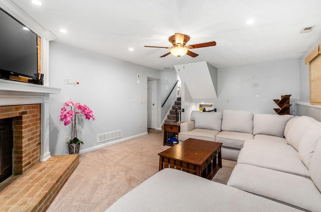 7484 Blue Fox Ln, Columbus, OH 43235 - living area with a brick fireplace, a ceiling fan, stairway, recessed lighting, and carpet flooring