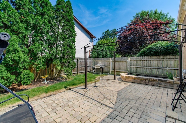 7484 Blue Fox Ln, Columbus, OH 43235 - fenced backyard featuring a patio area and a grill