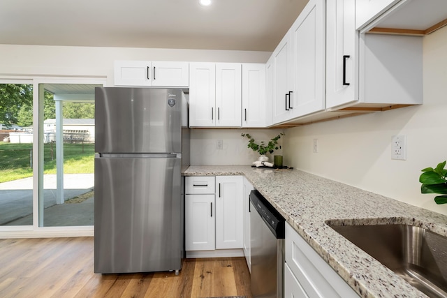 540 Mohawk Dr, Lancaster, OH 43130 - kitchen with appliances with stainless steel finishes, white cabinetry, light stone counters, light wood finished floors, and recessed lighting