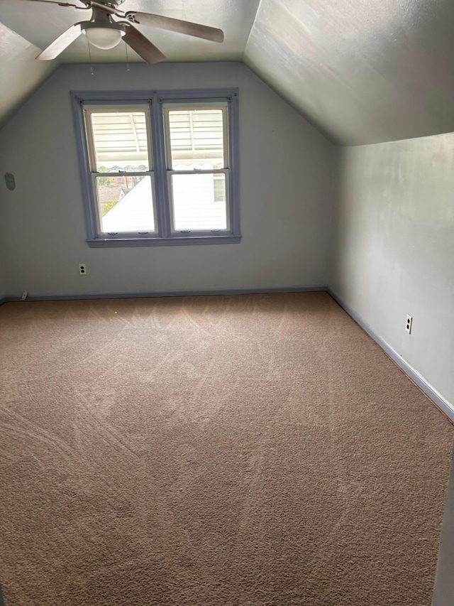 1155 E 26th Ave, Columbus, OH 43211 - additional living space featuring vaulted ceiling, a ceiling fan, and carpet