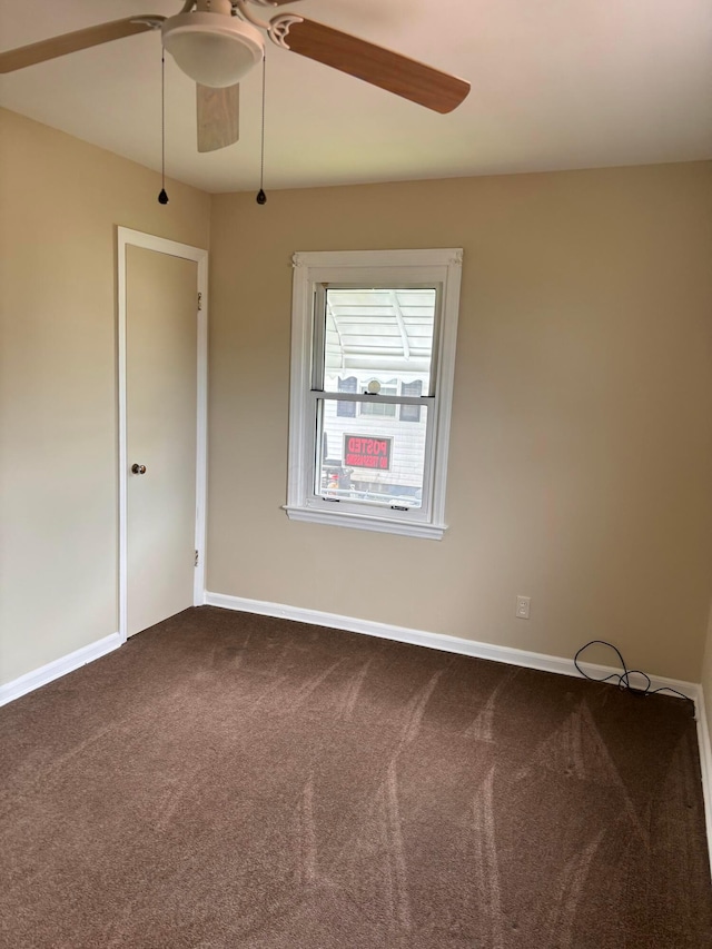 1155 E 26th Ave, Columbus, OH 43211 - empty room featuring ceiling fan and dark colored carpet